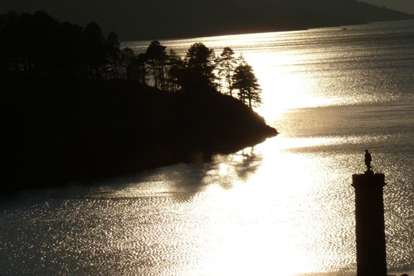 The Glenfinnan Monument as the sun sets over Loch Shiel