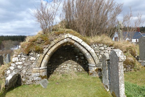 The medieval stone archway of a former church