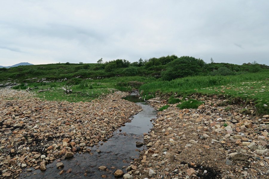 Cross the small stream and take the small path on the right heading inland