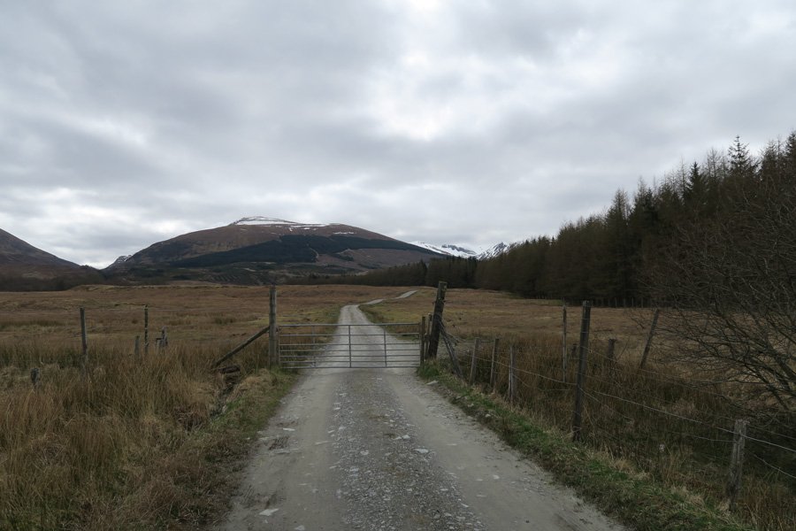 Pass through the gate and continue into the hills