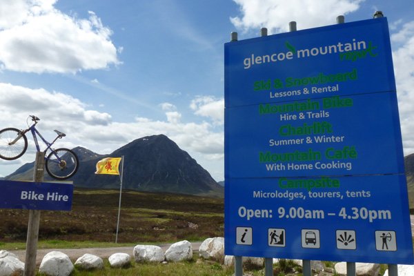 The sign for The Glencoe Mountain Resort and Ski Lift on the A82