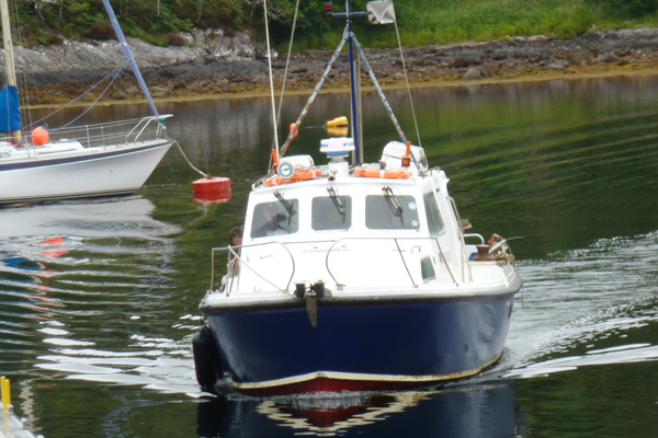 The Ardnamurchan Charters boat picking up passengers from Salen