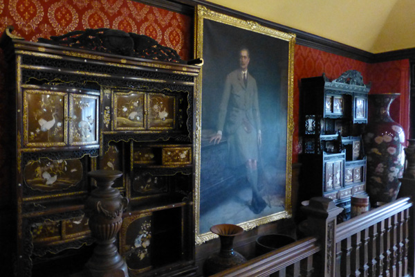 Portrait of Sir George in the galleried hall