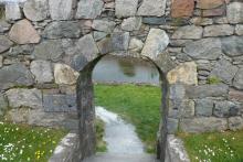 Stone archway leading to the beach