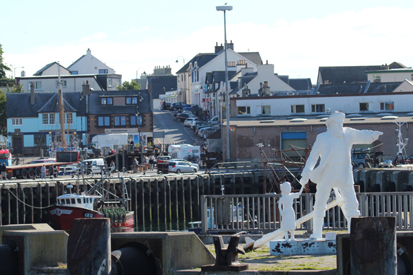 Fisherman and Child Sculpture by Mark Rogers on Mallaig Harbour